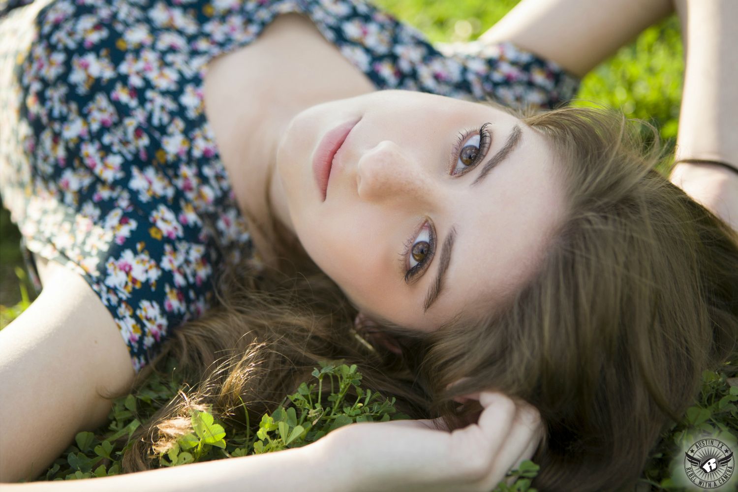 High school senior portrait photography in Austin at the Texas State Capitol of girl on the lawn.